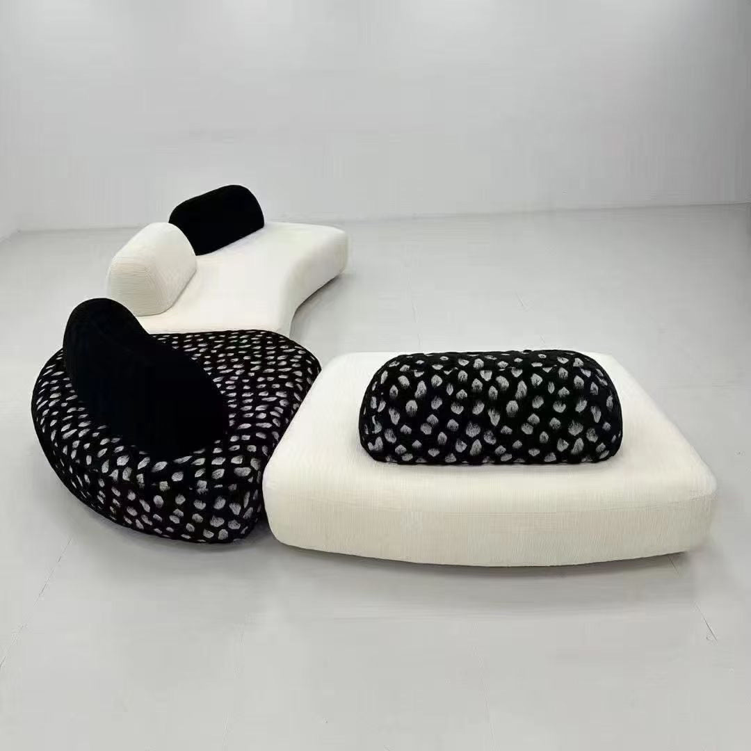 Canapé modulable bas en bouclette écrue et velours motif léopard