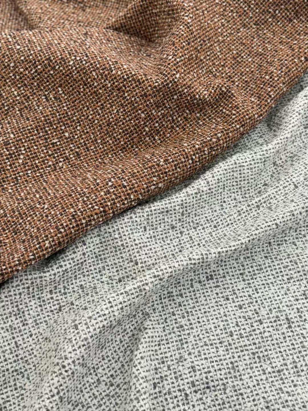 Fauteuil lounge en tissu bouclé chiné à accoudoirs cubiques – Archi